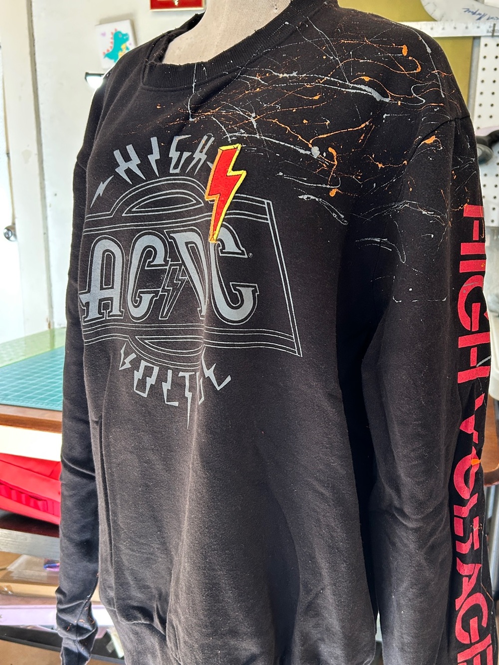 AC/DC Black Crewneck Sweatshirt with Lightning Bolt and Red Sleeve Text